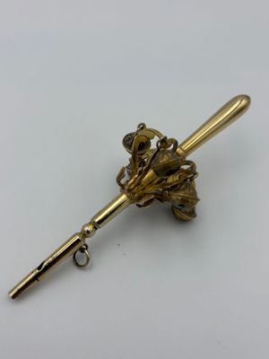 gold plated flower brooch pin on a white background