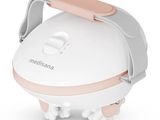 a close up of a white and pink machine on a white surface