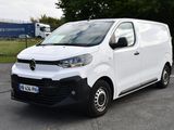 a picture of a white van parked in a parking lot