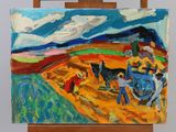 a painting on a easel with a painting of a man plowing a field