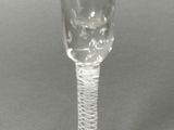 a wine glass that is sitting on a table
