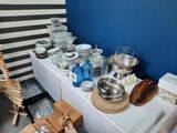 a table with a lot of dishes and bowls on it