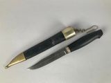 two black and gold pens sitting next to each other on a white surface