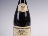 a bottle of wine that is sitting on a table