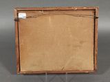 an old wooden box with a piece of paper on top of it