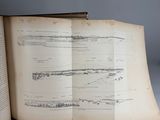 an open book with a drawing of ships on it