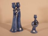 two blue vases sitting next to each other on a table