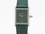 an image of a watch with a green leather strap