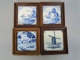 four framed blue and white tile pictures of windmills and windmills