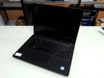 a laptop that is sitting on a table in a room
