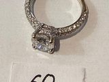 a diamond ring on display with a price tag