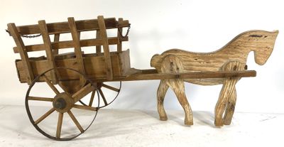 a wooden horse pulling a wagon with a wooden seat