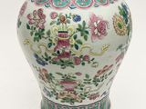 a vase that is sitting on a white surface