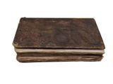 an old book sitting on top of a stack of books