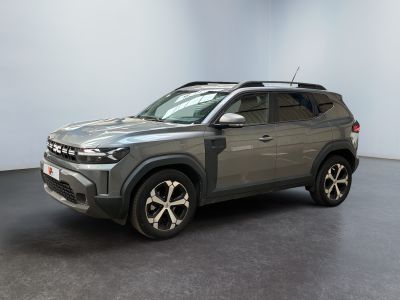 the grey suv is parked in a room with a black floor
