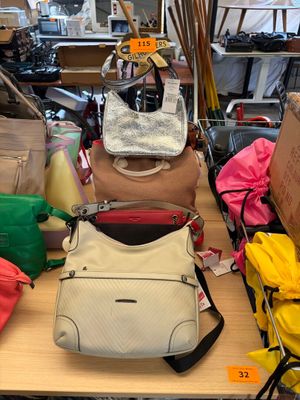 many bags on the table in the store