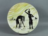 a plate with a picture of a woman and a horse