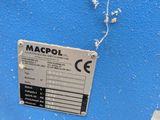 an image of a blue machine with a label on it ' s side