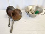two bowls and a spoon on a white table