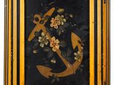 painting of an anchor and flowers in a gold frame on a white background