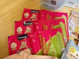 a bag of cat treats and a bag of cat treats on a table