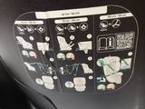 a close up view of a machine with a lot of stickers on it