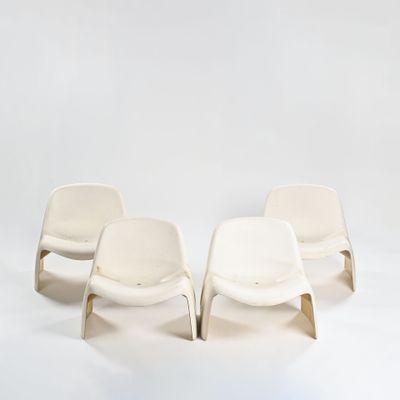 three white chairs sitting side by side against a white backdrop