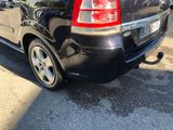 a picture of a black car parked in a parking lot