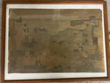 un tableau accroché au mur d'une pièce, avec un cadre en bois et une image sur le mur