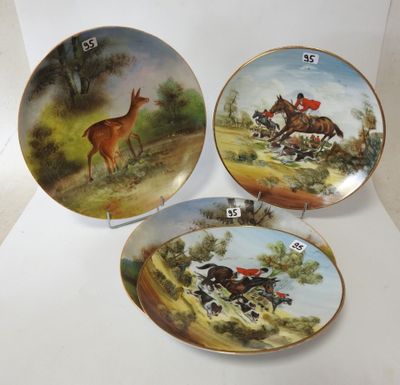 three plates with a picture of a deer and a deer on them