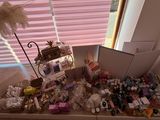 a box full of stuff sitting on the floor in front of a window