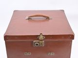 a brown suitcase with a handle on a white background