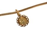 an image of a necklace with a gold charm on a chain