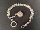 a close up of a chain bracelet with a padlock on it