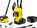 a yellow pressurer with a hose, hose, and other cleaning supplies