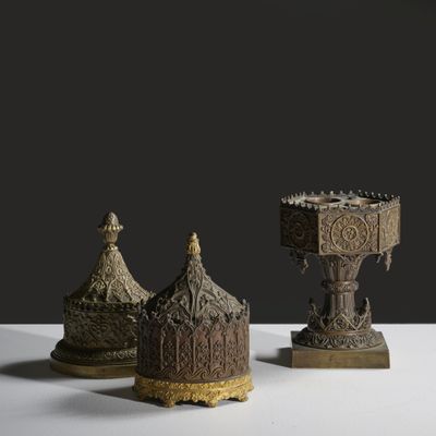 three different types of metal items on a white surface