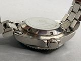 a close up of a watch on a table