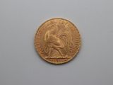 an image of a gold coin with a rooster on it