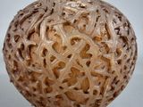 an image of a vase with intricate carvings on it