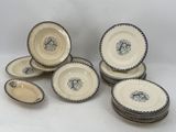 six pieces of blue and white dinner plates with a black and white design