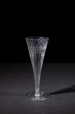 a glass vase that is sitting on a table