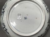 a white plate with a blue design on it