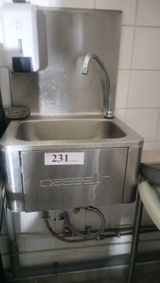 a stainless steel sink with a faucet on the side of it