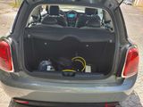 the back of a car with its trunk open with luggage in the trunk