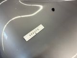 a close up of a metal object with a name tag on it