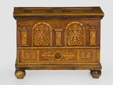 an old wooden chest with ornate carvings and carvings on the sides