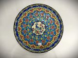 a blue plate with a floral design on it
