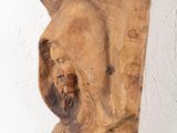 an image of a wooden sculpture of a man with a beard and a hood