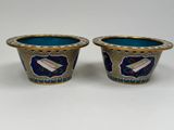 pair of blue and gold vases on a white background