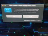 the screen of a computer with a blue button on it